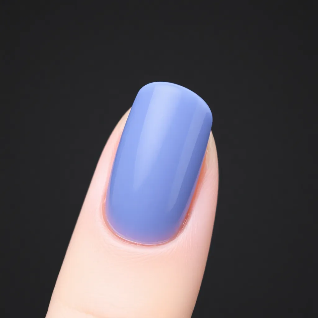 A close-up of a nail with a gel polish finish